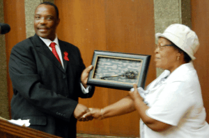 Mita Molete’s mother receives the key to their new house from the Executive Mayor Cllr. Mahole Simon Mofokeng